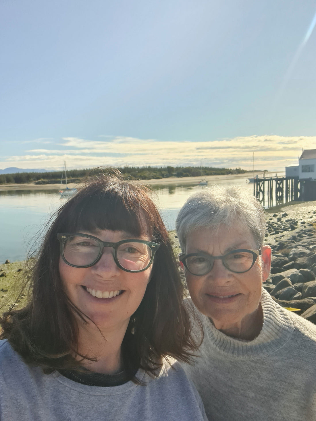 Meg Roukston and her Mum standing infrint if Mapua wharf on a sunny day