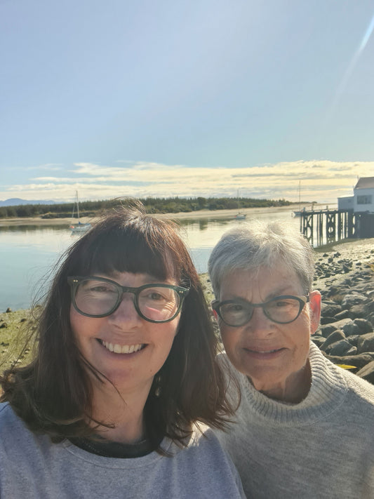 Meg Roukston and her Mum standing infrint if Mapua wharf on a sunny day
