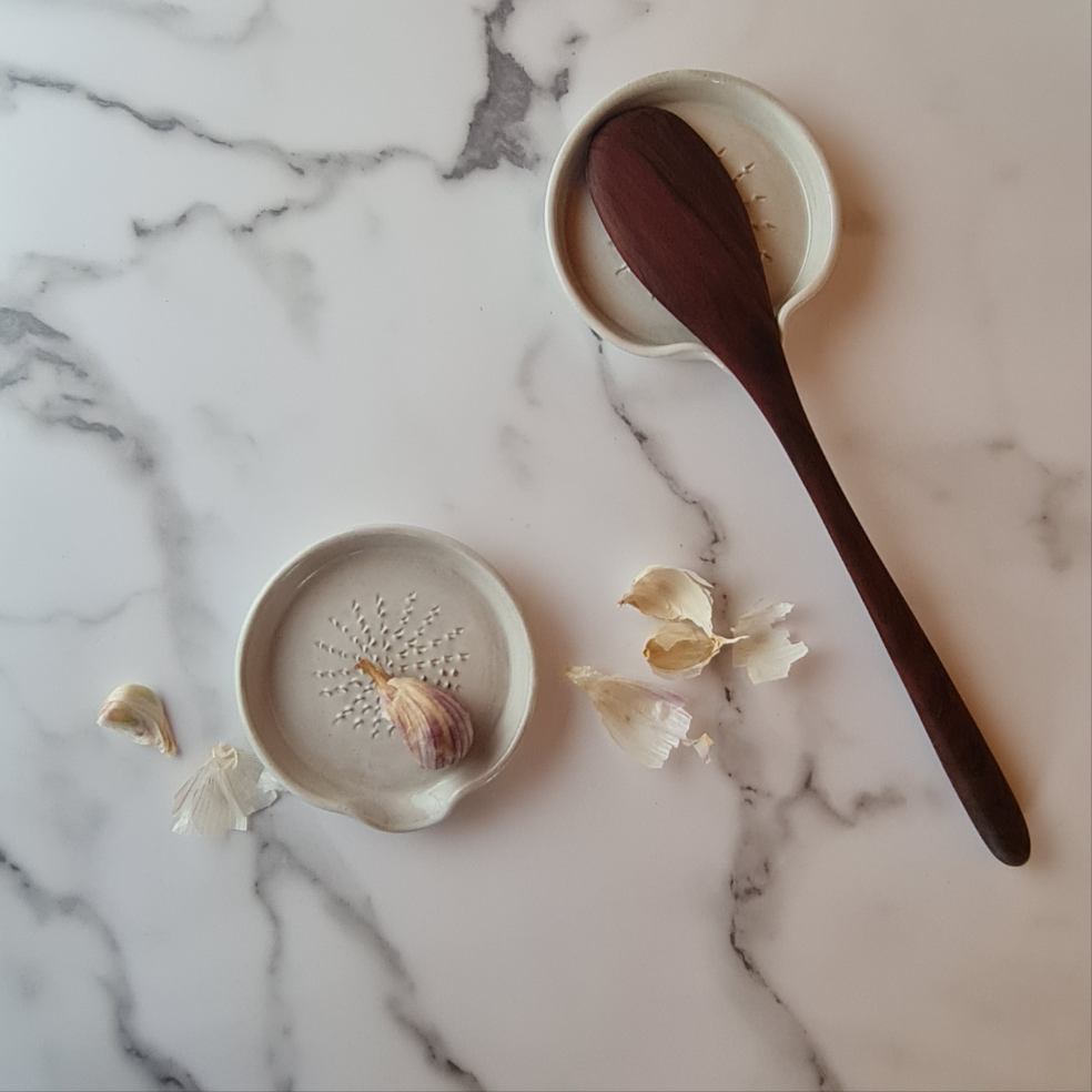 White ceramic garlic-ginger grater